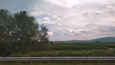 Well-tended fields and roads in the countryside under a cloudy sky 스톡 동영상 332330453