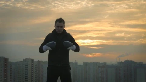 Well trained boxer man on the sunset background Stock Footage 83282865