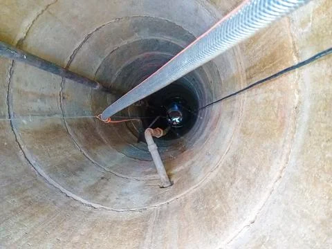 Well view from the inside. View from inside vertical tube downcast shaft Stock Photos