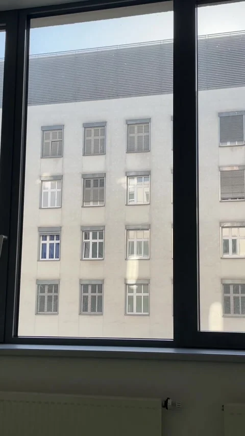 Welllit office overlooking neighboring structures during midday hours Stockbeeldmateriaal 347326101