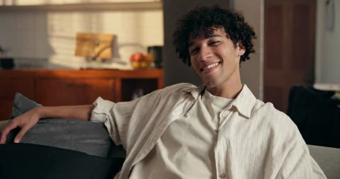 Wellness, face and man in house with laugh, positive attitude or chill on Stock Footage 329365637