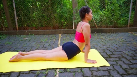 Wellness focused female performs exercise on mat Stock-Footage 310287118