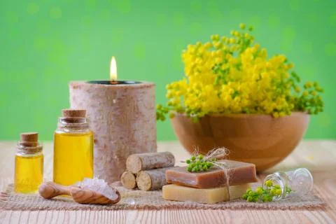 Wellness, spa and aromatherapy with essential oils, fresh plants, candle, soap Stock Photos