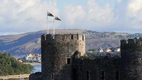 Welsh flags flying at Conwy Castle Conwy Gwynedd Wales Stock Footage 93879153