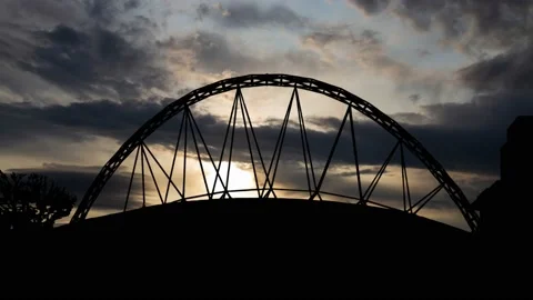 Wembley Park: Time Lapse at Sunrise with Fast Clouds and Silhouette of Stadium Stock Footage 160113342
