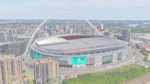 Wembley Stadium and iconic arch above Wembley Park with dense urban development Stockbeeldmateriaal 344915667