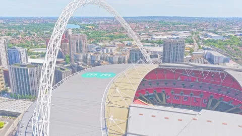 Wembley Stadium arch and interior seating bowl during a close drone descent Stock Footage 344915482