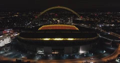 Wembley stadium at night time with lights on in England, UK Stock Footage 102408999