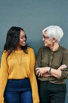 Were always on the same page. two cheerful businesswomen having a discussion Stock Photos