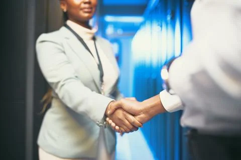 Were coming together for a technological future. two unrecognizable IT Stock Photos