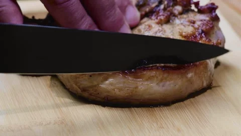 We're cutting the steak Stock Footage 247578076