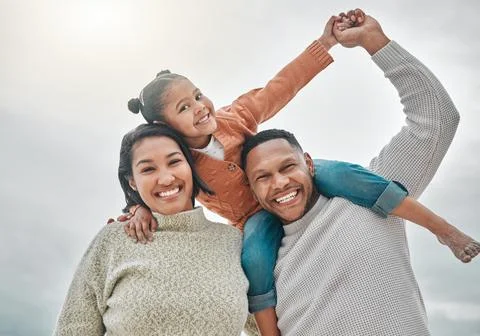 Were inseparable. an affectionate family of three on the beach. Stock Photos