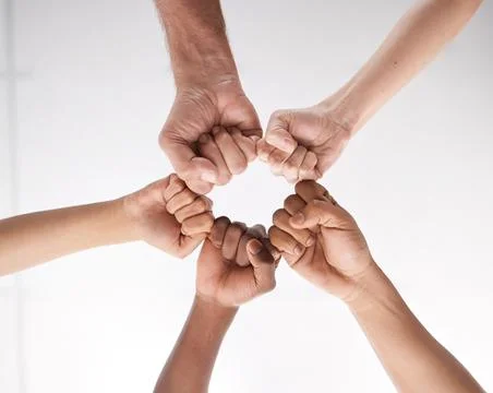 Were more powerful when we pull together. Low angle shot of a group of busine Stock Photos