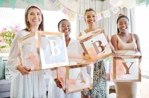 Were so happy for you mama. a group of women holding a sign at a friends b... Stock Photos