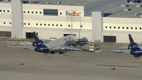 Wescam YYZ FedEx Cargo Pull to Wide Stock Footage 76580770