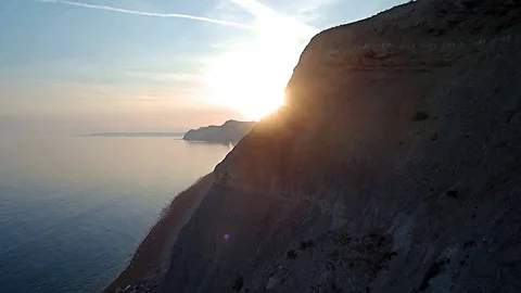 West Bay Cliffs sun reveal 스톡 동영상 79305435