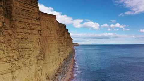 West Bay Dorset 4k dramatic track along cliifs half way up (Broadchurch) Stock Footage 138297999
