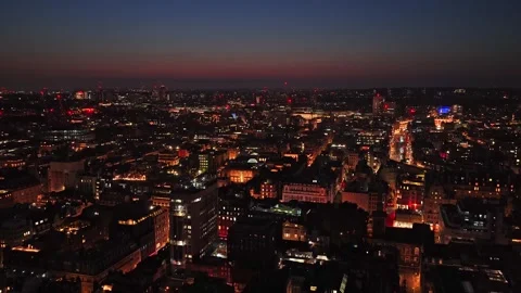 West End Rooftops and Lit Street Corridor at Dusk under Red Horizon, City of Stock-Footage 348216972