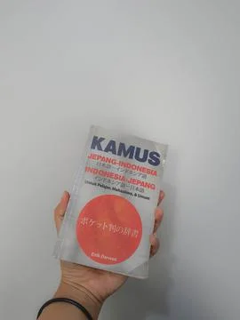 West Java, August 2022. A hand is holding a Japanese-Indonesian dictionary fo 스톡 사진