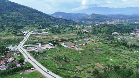 West Java, Indonesia - April 8, 2025: Aerial view  of Jalan Letjen Ibrahim Adjie Vídeos de archivo 311916338