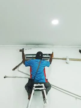 West Java, Indonesia in July 2022. A technician is repairing and cleaning a b Stock-Fotos