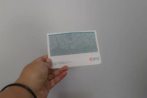 West Java, Indonesia on July 2022. A hand is holding a Bank National Indone.. Foto stock