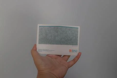 West Java, Indonesia on July 2022. A hand is holding a Bank National Indone.. Stock Photos