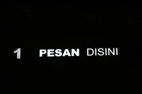 West Java, Indonesia on July 2022. Glowing McDonalds restaurant sign agains.. 库存照片