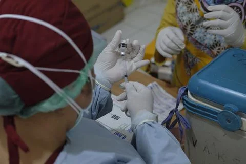 West Java, Indonesia, March 9, 2021 - Nurse prepare the COVID-19 vaccine prod Stock Photos
