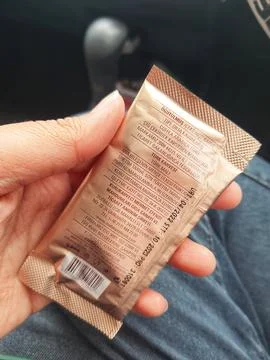 West Java, Indonesia in October 2022. A hand is holding a Turkish coffee sach Stock-Fotos