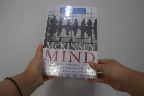 West Java, Indonesia on October 2022. A hand is holding a best selling book.. Stock Photos