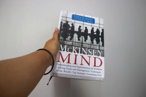 West Java, Indonesia on October 2022. A hand is holding a best selling book.. Stock Photos