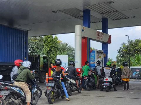 West Java, Indonesia in September 2022. Motorcyclists queue long enough at Pe Photos