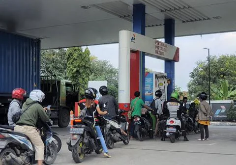 West Java, Indonesia in September 2022. Motorcyclists queue long enough at Pe Photos