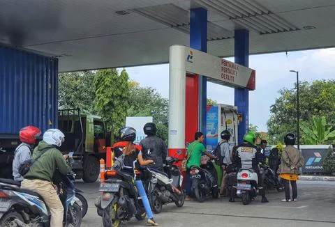 West Java, Indonesia in September 2022. Motorcyclists queue long enough at Pe Photos