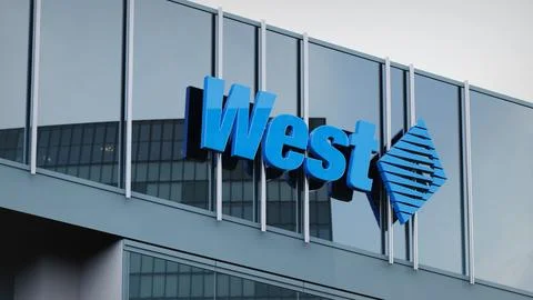 West Pharmaceutical Stock data presented on the logo of the office facade Stock Photos
