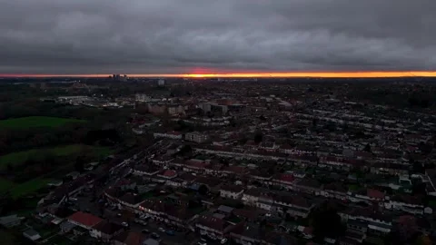 Westbound Drone Flight Over Ealing, West London at Dusk with Rooftops and Stock Footage 324691446