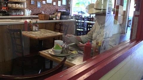 Western Man, Small town middle America, man seen drinking in cafe Video stock 111672277