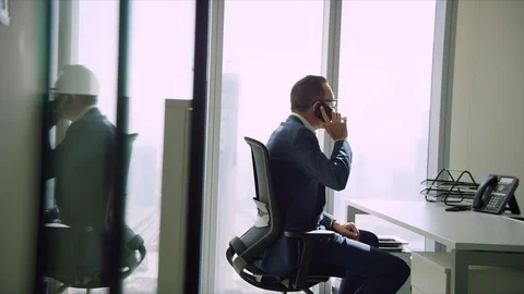 Western man talking on his mobile. Stock Footage 129401657