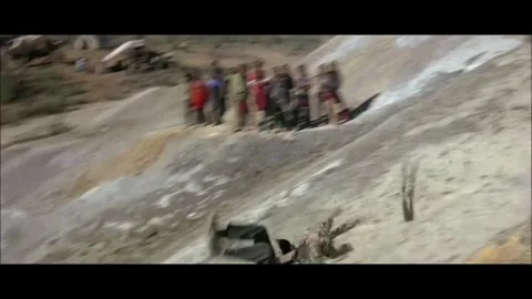 Western - Men slide down a hill through mud Stock Footage 284656028