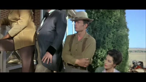 Western - A queue of people standing on the threshold of a house is shown Stock Footage 284655833