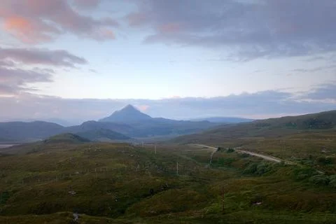 The western slope of Mount Ben Stack and the road through the valley at dawn Stock Photos