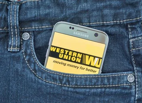 Western Union mobile application on screen of Samsung Fotos Stock