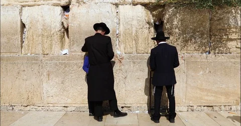 Western Wall Men Praying boy 2 4K Stock Footage 128710843