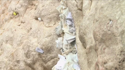 Western Wall - Notes full with prays between the stones Stock Footage 604661