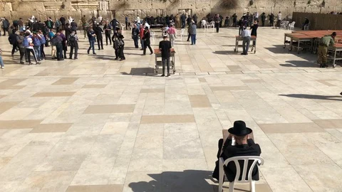 Western Wall or Wailing Wall or Kotel in Jerusalem. People come to pray to the Stock Footage 102154155