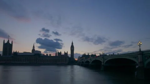 Westminster Bridge, Big Ben and Parliament reflect golden sunset in wide Stock-Footage 317840913