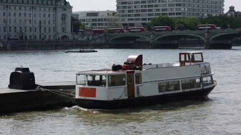 Westminster bridge with red buses and boats in Thames River, London, England Stock Footage 77520732