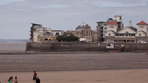 WESTON, UK - AUGUST 8, 2025 - Tourists walking on Weston super Mare beach with Stock Footage 314804468