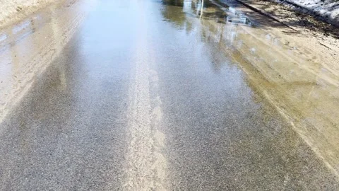 Wet asphalt road with reflection of melt water, road surface after spring  Vídeo Stock 330360673